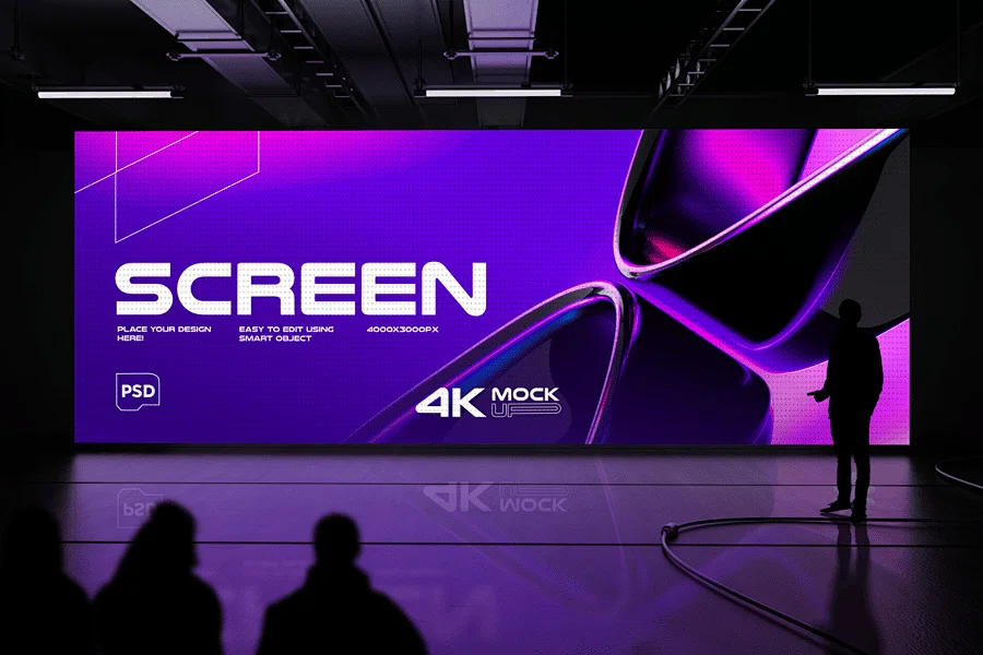 Wide indoor LED presentation wall viewed by a conference audience