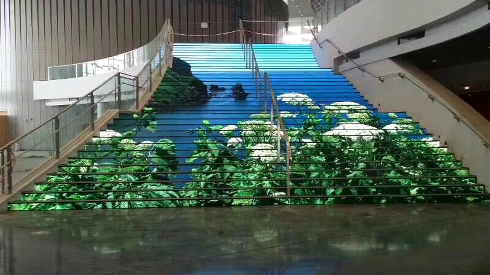 Architectural LED floor display integrated into a staircase
