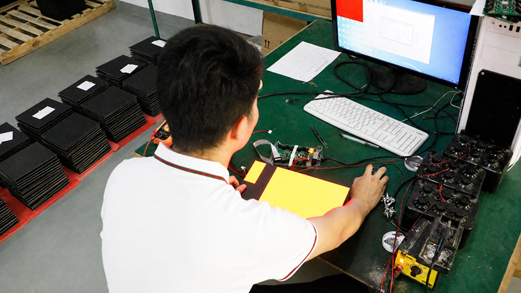 Technician debugging LED modules and components