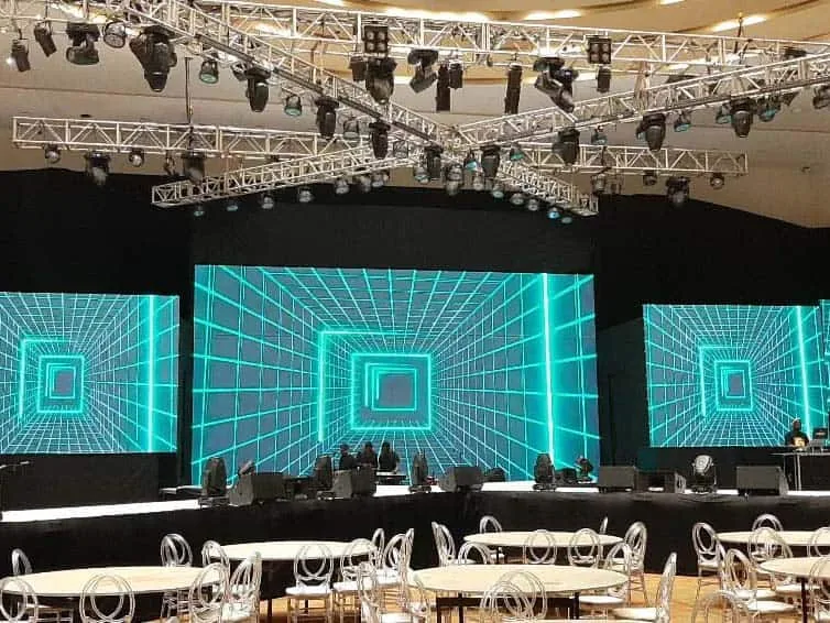 Multiple LED screens prepared for a corporate event stage