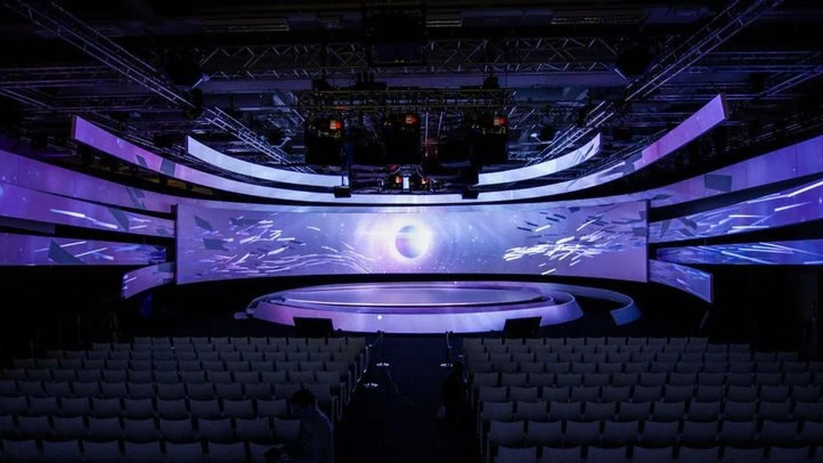 Hanging modular LED displays arranged around a live-production stage