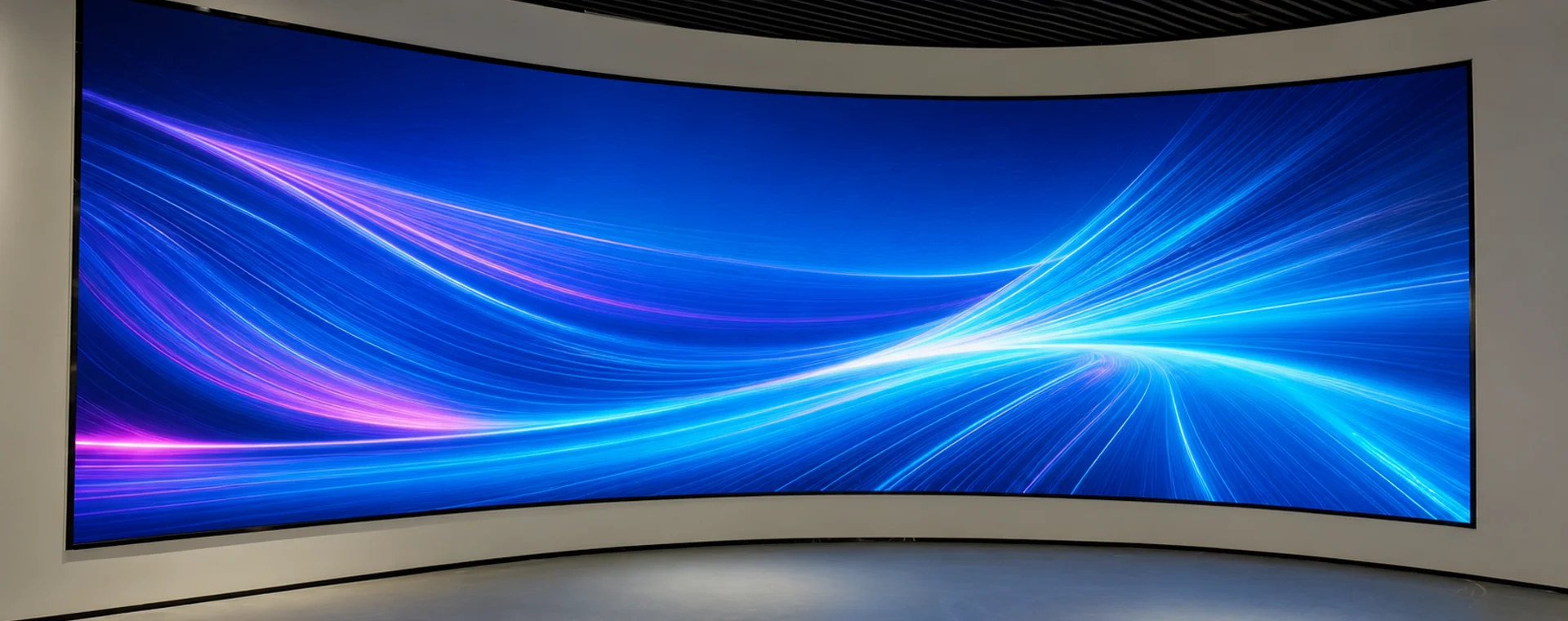 Large concave flexible LED display installed as a continuous curved wall