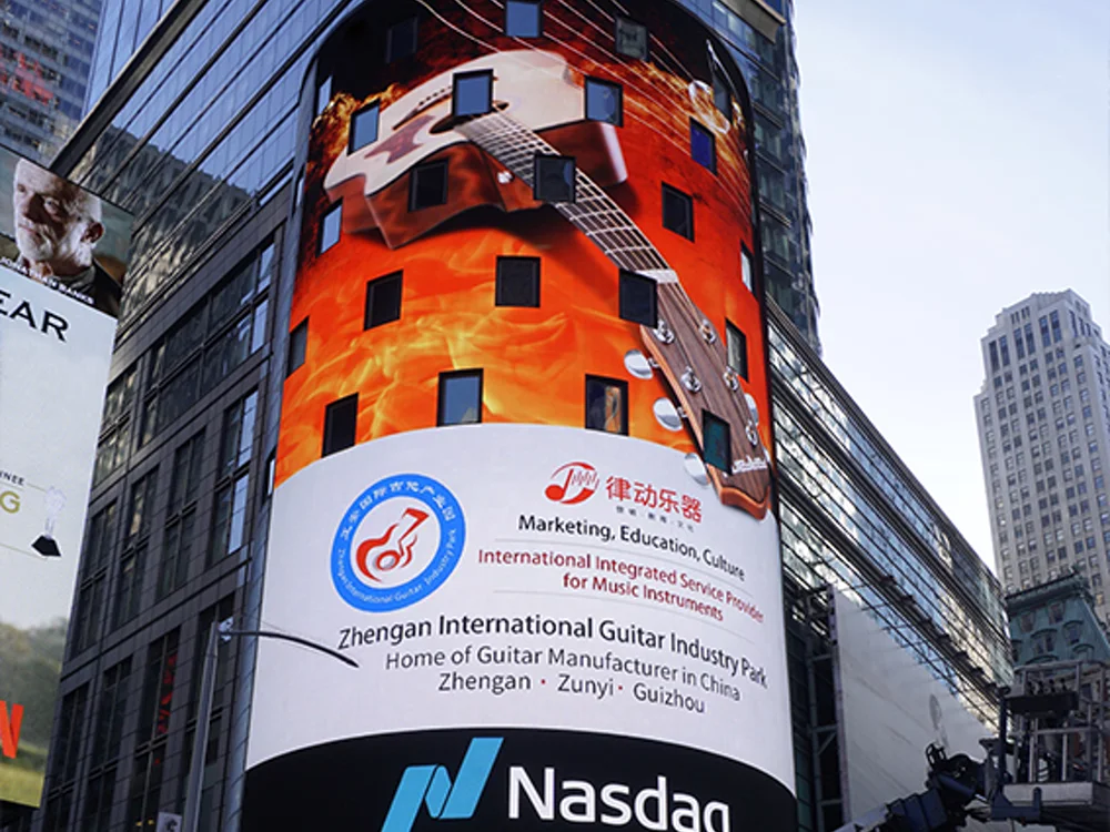 Outdoor curved LED display integrated into a building corner
