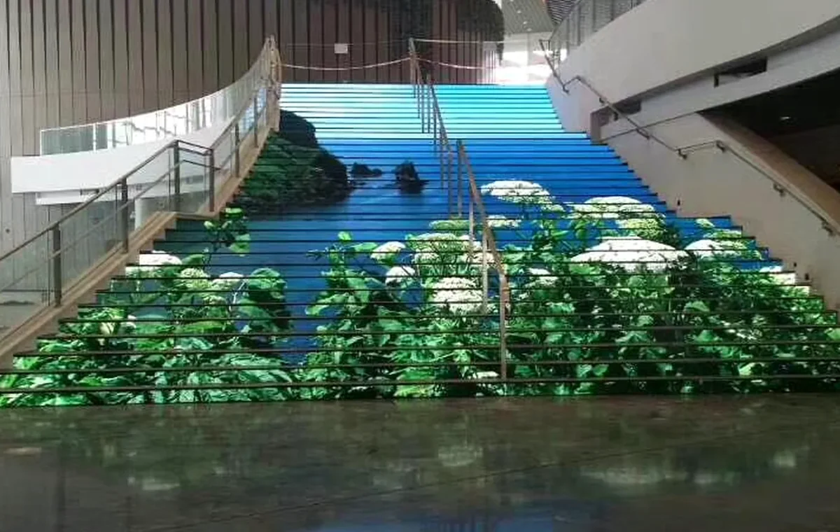 LED floor display integrated across a wide commercial staircase