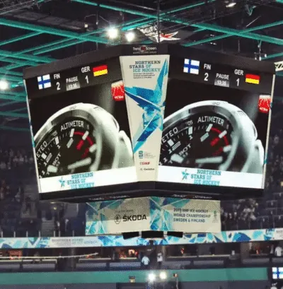 Multi-sided center-hung LED scoreboard inside a professional sports arena