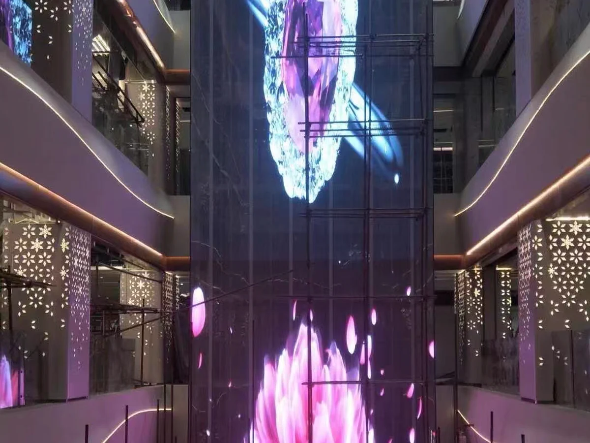 Transparent LED display installed through a multi-level shopping atrium